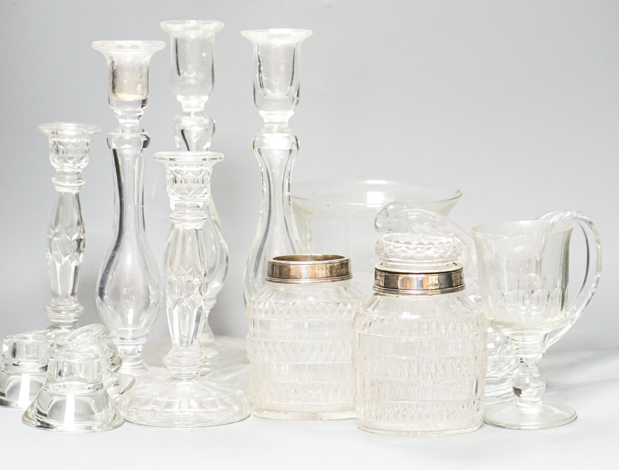 A trio of Colelfax and Fowler clear crystal candlesticks and other clear glasswares, jar height 15cm overall